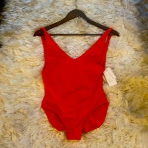 Londre NWT one piece in red. Size small.